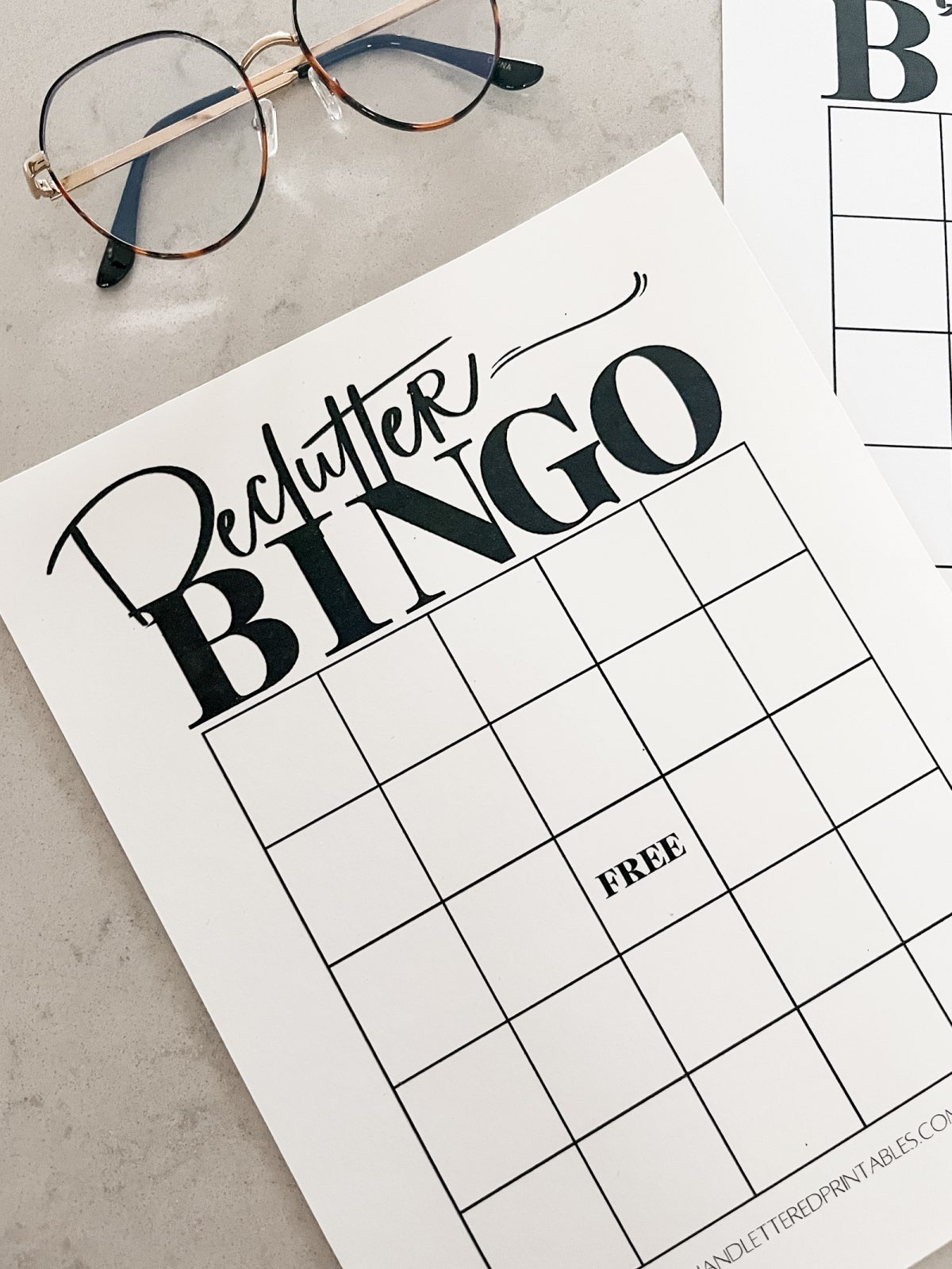 Declutter Bingo Card printed off on counters with glasses