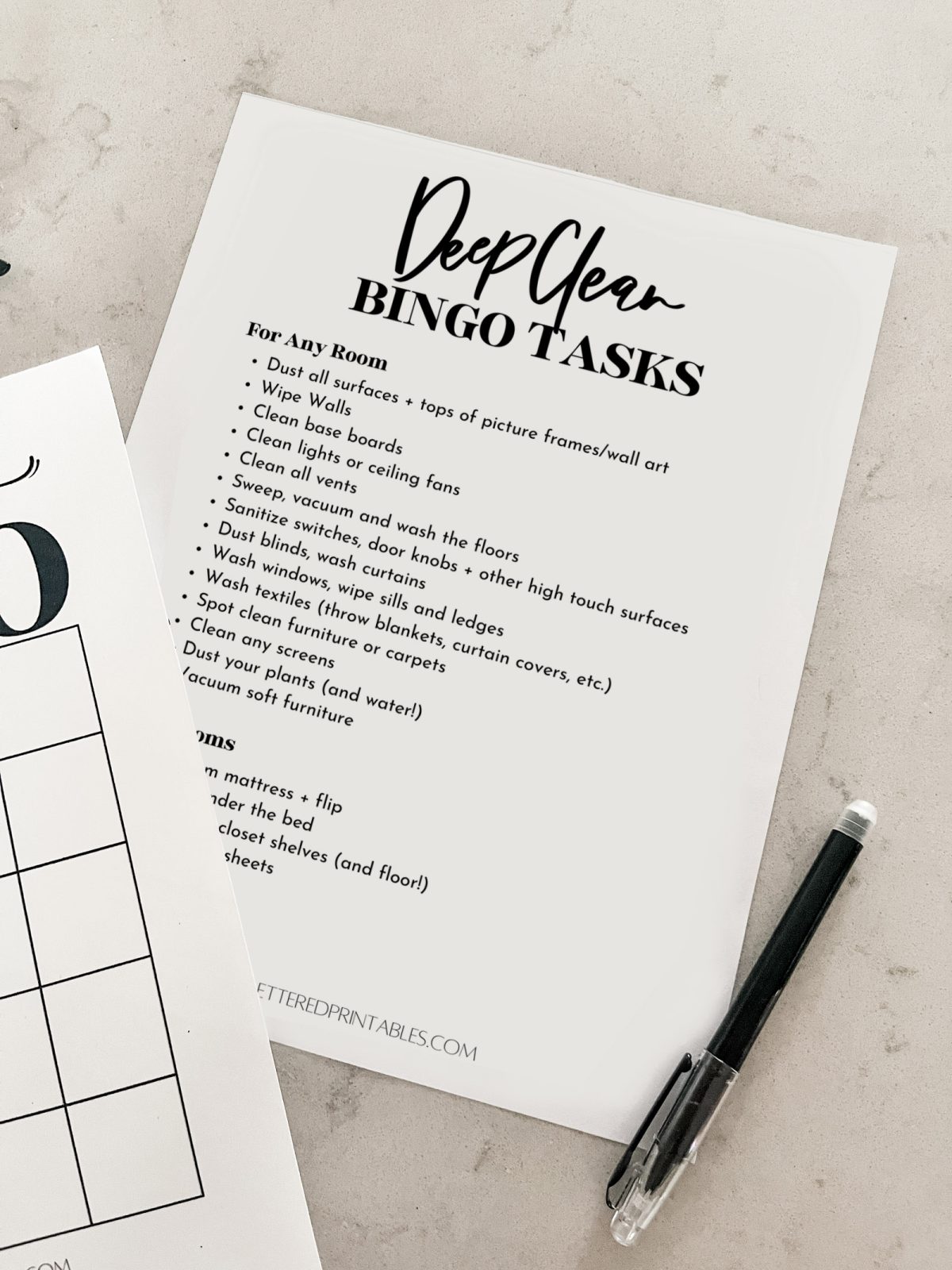 deep clean tasks that are bite sized (free printable) on countertop with pen