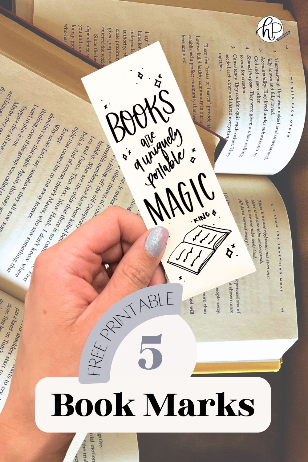 5 Free printable bookmarks with quotes about reading. image of one book mark being held over books. bookmark reads: books are a uniquely portable magic