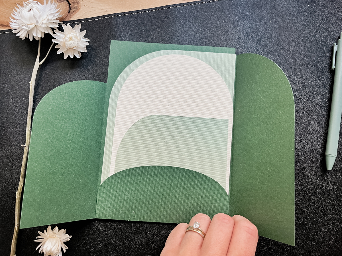 Download the free SVG template to make your own trifold pocket invitations using your Cricut. Invitation shown assembled without customization