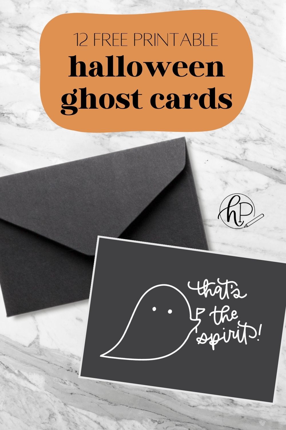 Free printable halloween ghost cards, one of the 12 designs is shown printed with a black envelope. card features line art ghost holding flag and hand lettering that says 'that's the spirit'.