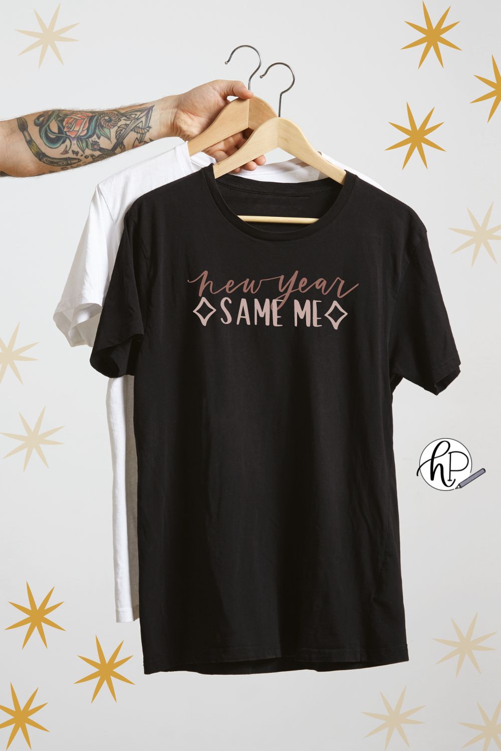 new year same me svg design on black t-shirt being held by hand on hanger with stars in background