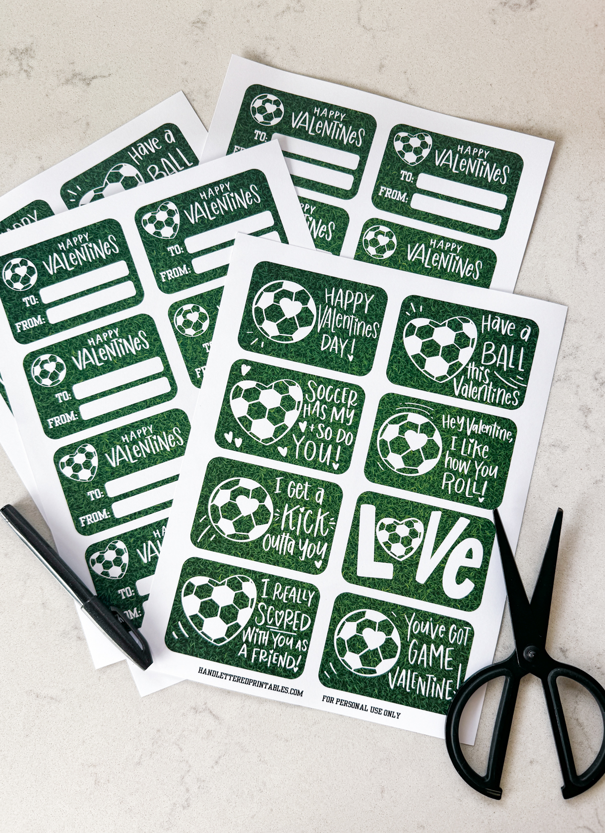 image shows soccer themed valentines printed in full sheets, ready to be cut to size valentines have a heart shaped soccer ball and a soccer ball with a heart on it and a grass background. valentines puns and sentiments include: happy valentines day, have a ball this valentines, hey valentine i like how you roll, soccer has my heart and so do you, i get a kick outta you, love (with a heart soccerball as the o), you've got game valentine, and i really scored with you as a friend reverse reads 'happy valentines' with room for to and from names. soccer/ american football