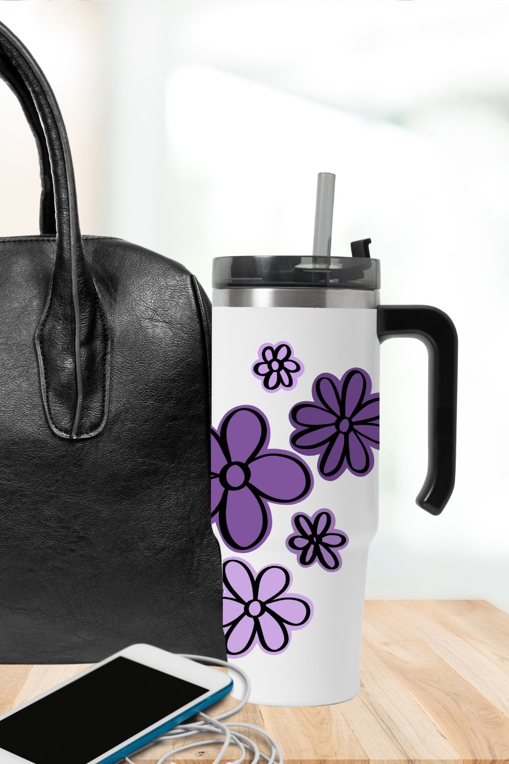 2 Layer cut file of 5 hand drawn flowers (free), shown cut from permanent vinyl on a tumbler with a purple background layer and black flower outline.