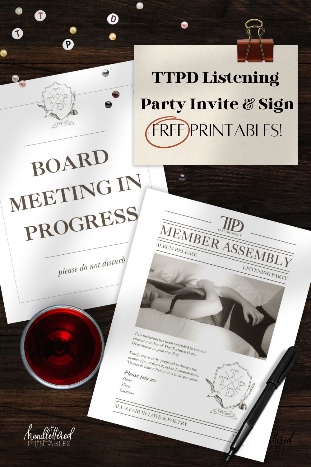 image of TTPD Listening Party Invitation and Signage on a dark wood table with friendship bracelet beads, glass of red wine and pen. note card with binder clip reads: TTPD Listening Invitation and Sign Free Printables