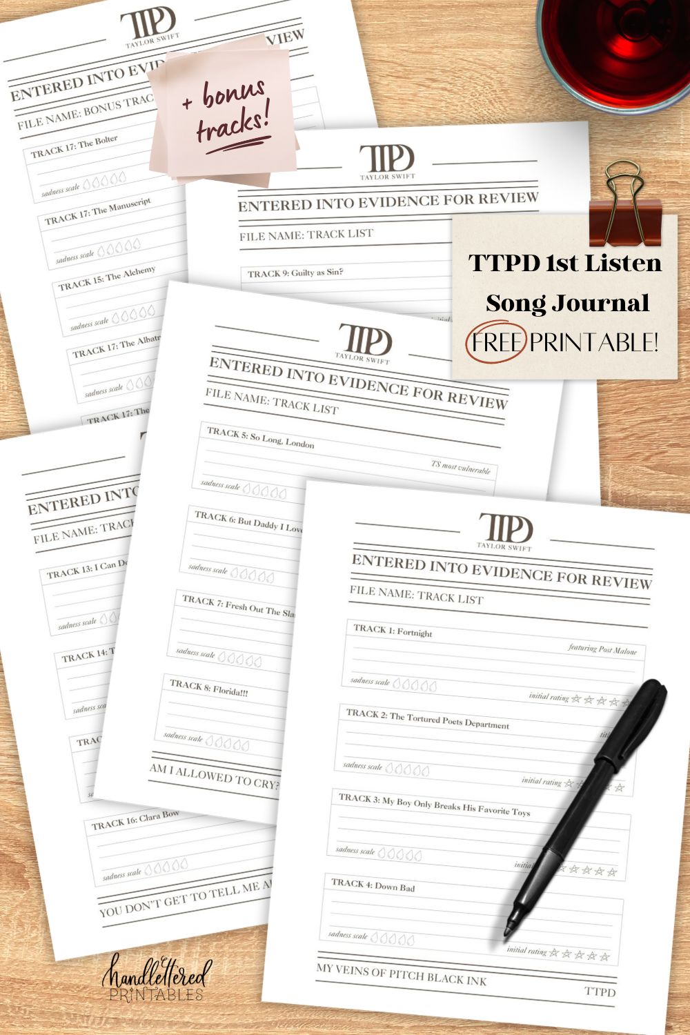 image of printed papers on light wood table with a glass of red wine, charcuterie board and pen. Post it notes read: TTPD 1st Listen song journal free printable + bonus tracks
