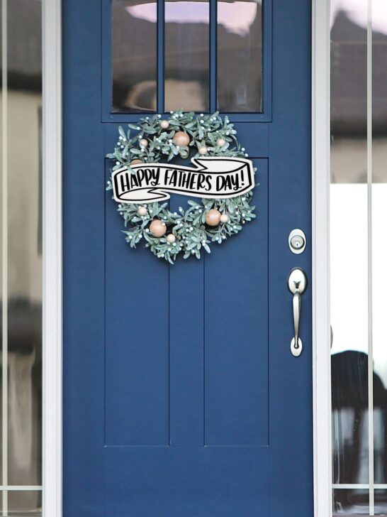 happy fathers day banner on wreath on a blue front door made from free happy fathers day svg cut file
