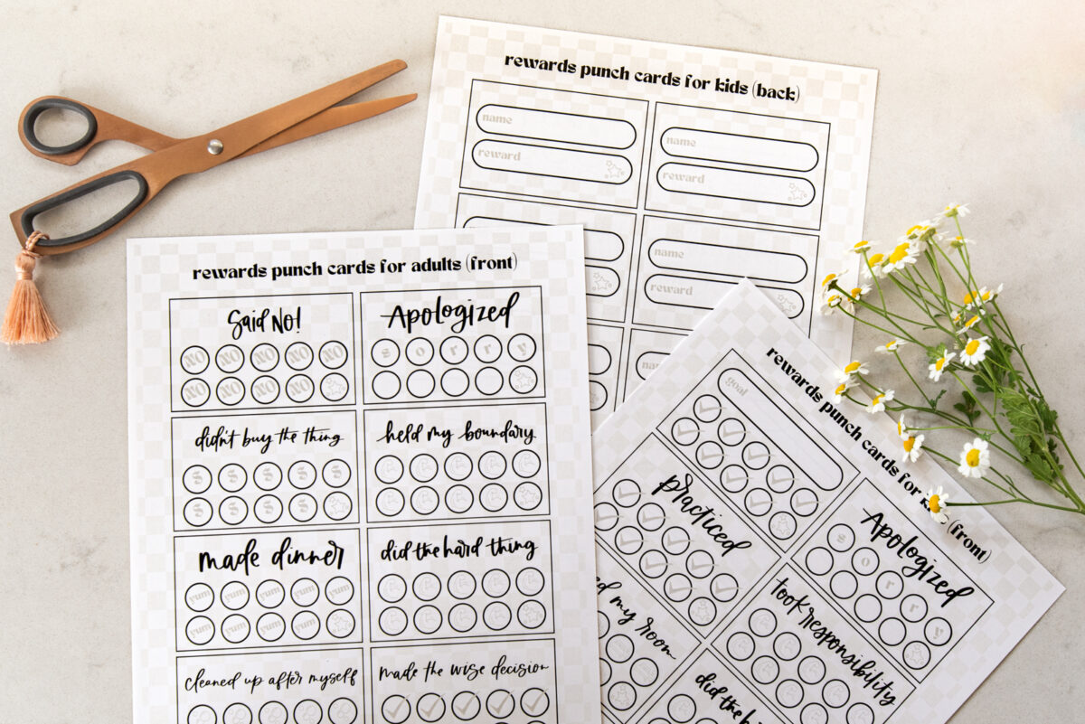image of printed punch cards for adults and kids, ready to be cut out with scissors punch cards have a soft checkerboard background with hand lettered goals like 'said no!', 'didn't buy the thing', 'made dinner', 'held my boundary' and 'made the wise decision'