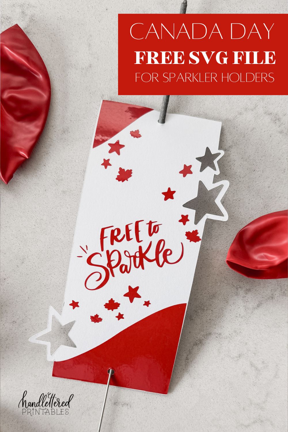 image of sparkler holder made with cricut- design has stars and maple leaves and the hand lettering 'free to sparkle' sparkler holder shown on marble countertop with red and white balloons text over image reads: canada day free SVG file for sparkler holders