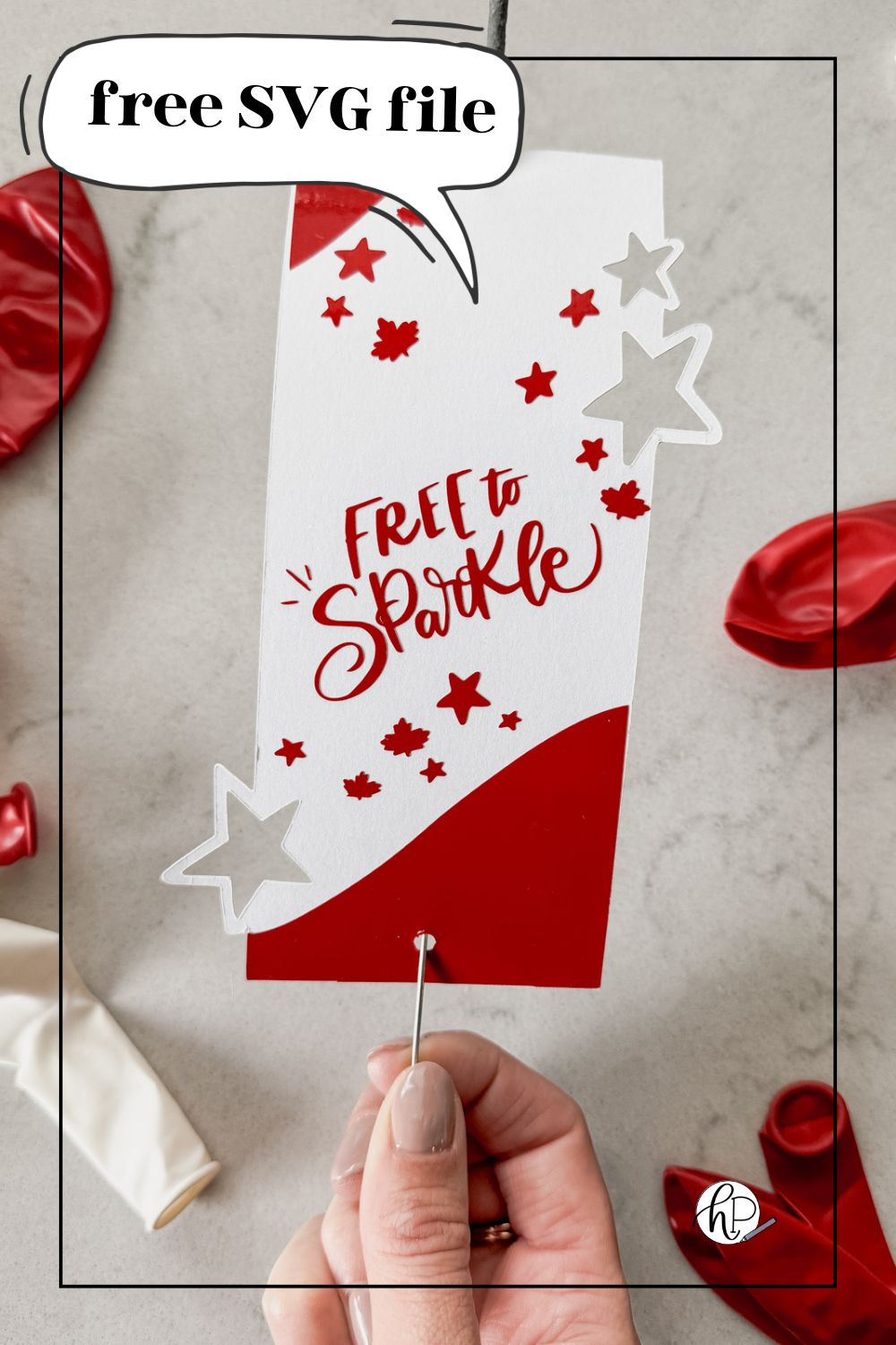 image of sparkler holder made with cricut- design has stars and maple leaves and the hand lettering 'free to sparkle' sparkler holder shown held over marble countertop with red and white balloons text over image reads: free SVG file